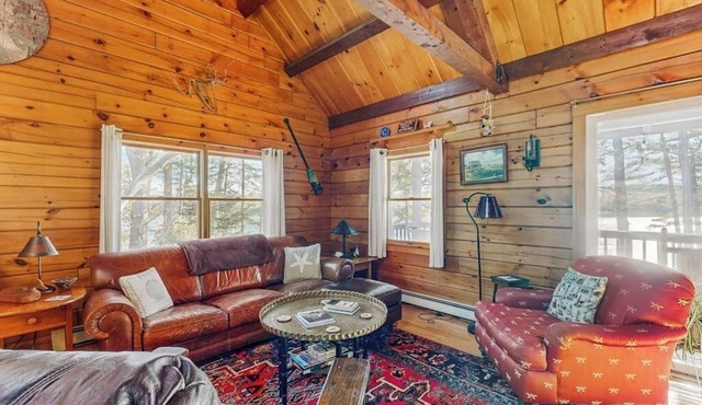Charming riverfront home with cozy interiors, dock, and scenic deck views in Westport Island