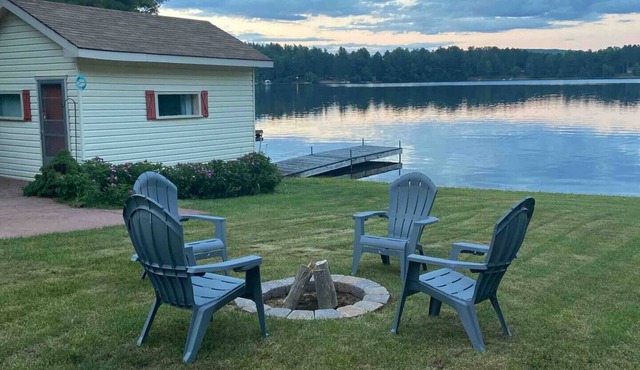 Family beach front with flat shoreline for swimming and water front living space in Combermere