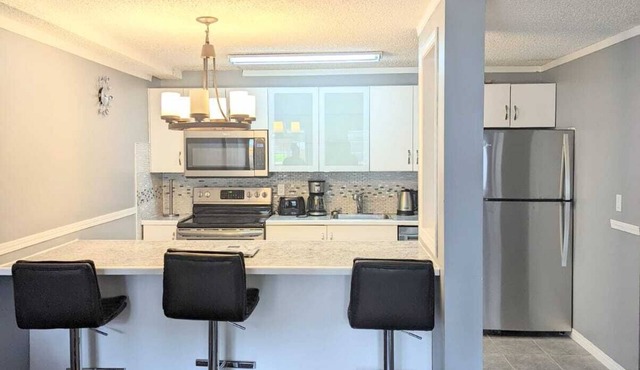 Fully furnished 2 bedroom condo w/free parking on premises