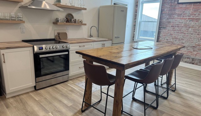 Golden Acre Suites | 3BR Downtown Loft w/Exposed Brick & Urban Charm