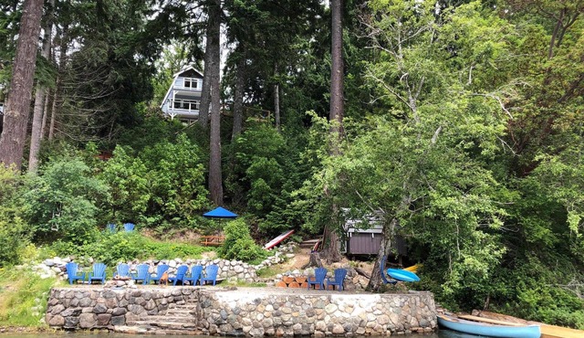 Gorgeous Chalet Style Lake house with four decks and huge dock.