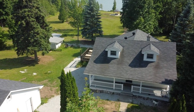 Large farmhouse style cottage located on three acres of waterfront property.