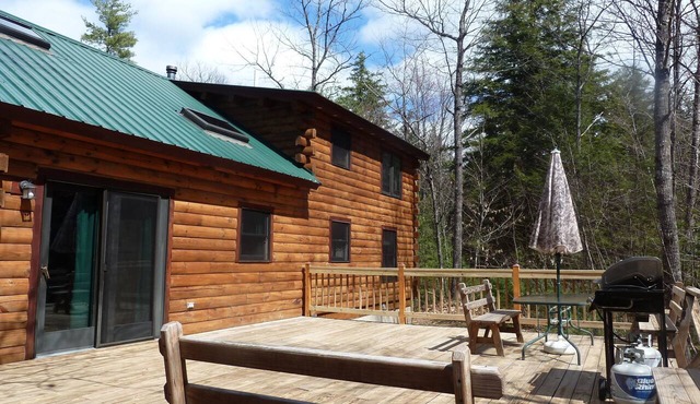 Log Cabin on Spacious Lakeside Woodlands, with Private Beach and Waterfront. in Fryeburg