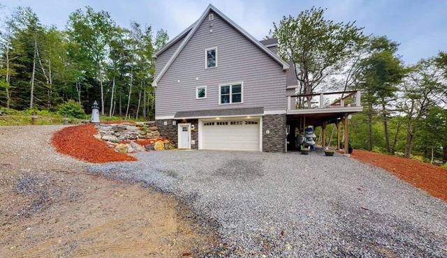 Luxurious waterfront home with deck, firepit, hot tub, fireplace, & pool table
