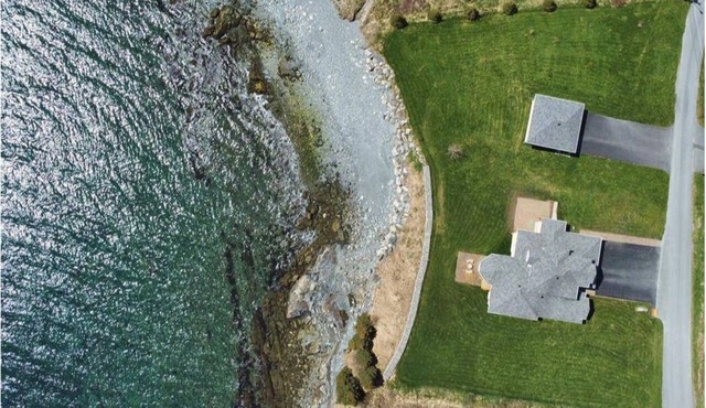 Oceanfront, direct shoreline access, main floor master, and full ensuite.