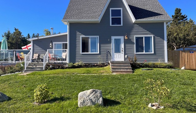 Renovated 150 year old house, snuggled in the cove with ocean views