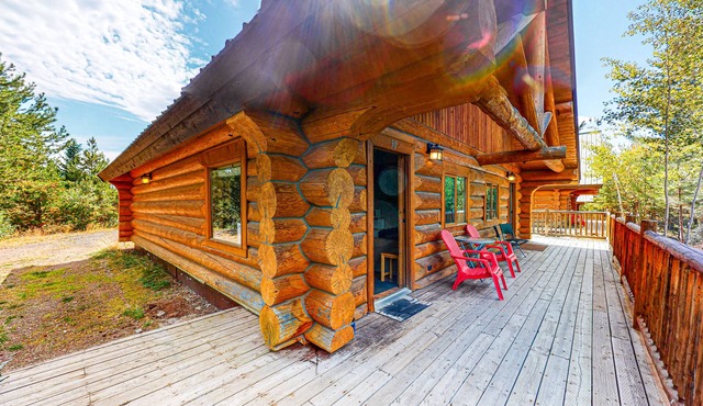 Rustic lakefront resort log cabin with deck, internet, and full kitchen