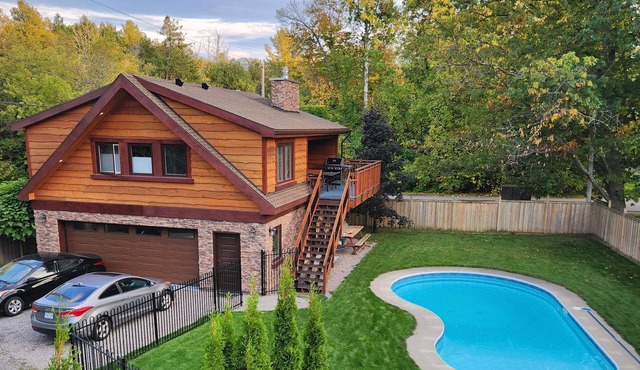 Rustic luxury chalet with fenced yard and pool, walk to beach and playground
