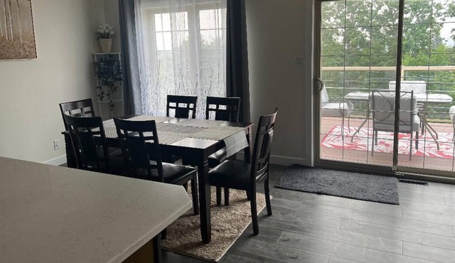 spacious 5 bedroom home with a game room, walk-in basement, and overlooking deck