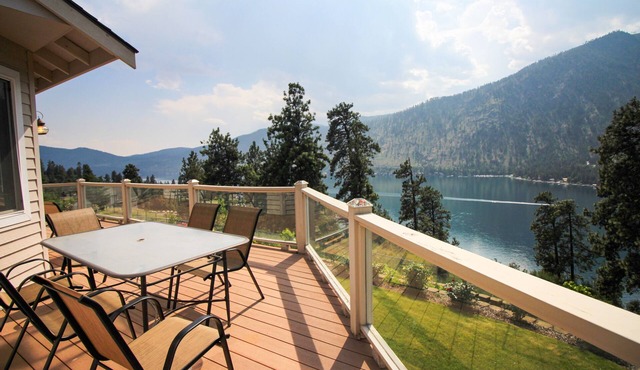 Spacious & Welcoming Home with Lake View, Private Hot Tub, & Wraparound Deck in Manson