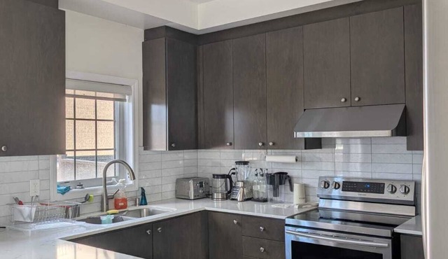 Steps to Heartland Town Centre! Cozy Home with a Huge Backyard