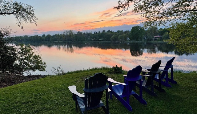 Stunning Century Riverfront Estate with sweeping waterfront views.