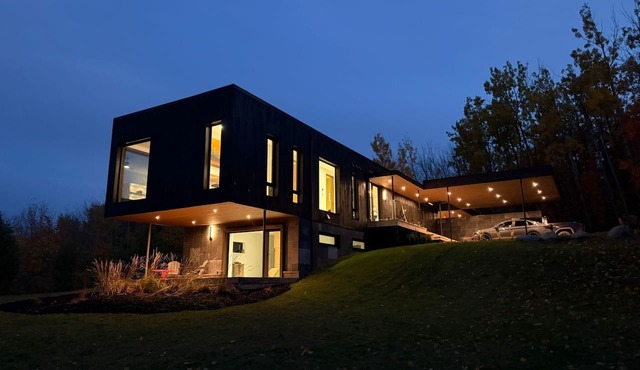 Stunning Modern Architectural Home on 5 acres of forest with hilltop lake views