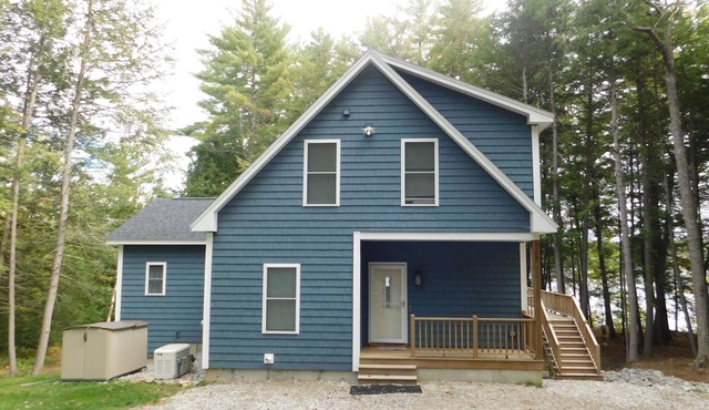 Stunning modern home in peaceful, private setting on desirable Long Lake.