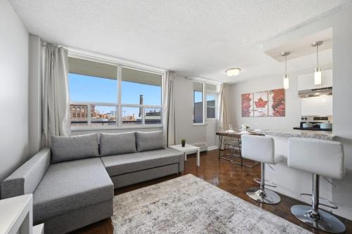 Stylish 2BR condo with 2 Balconies & Workspace