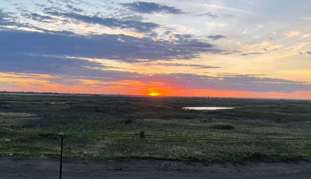 Sunset at Prairie Luxury Suite with NE Swale View
