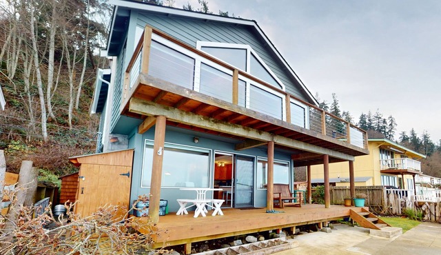 Waterfront home with views, deck and open concept living in Langley
