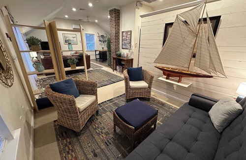 Yachting Village Apartment | Unwind in harbor luxury at this sophisticated studio in Newport's Yachting Village! Cozy queen bed + pull-out sofa bed, fully stocked kitchen, huge deck with sunset harbor views, mini-split AC, TV, off-street parking. Steps to marinas, Thames Street