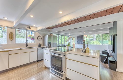 District of North Vancouver House | Modern 4BR Mid-Century Home - Solarium, Deck & Jacuzzi