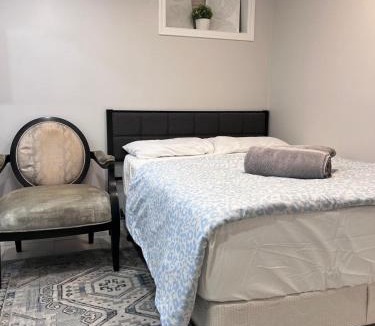 Milton Apartment | Studio Basement Suite with Double Bed and kitchen, Entrance from Garage