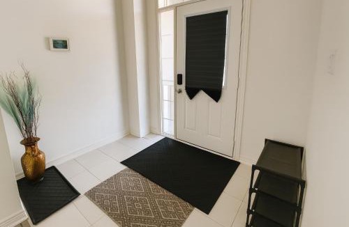 Cambridge House | 2024 Built 3-Bedroom Cambridge Townhome with Free Parking, WiFi, Full Kitchen, Laundry & Foosball - 8 Mins to African Lion Safari - Great for Families, Groups & Work Stays!